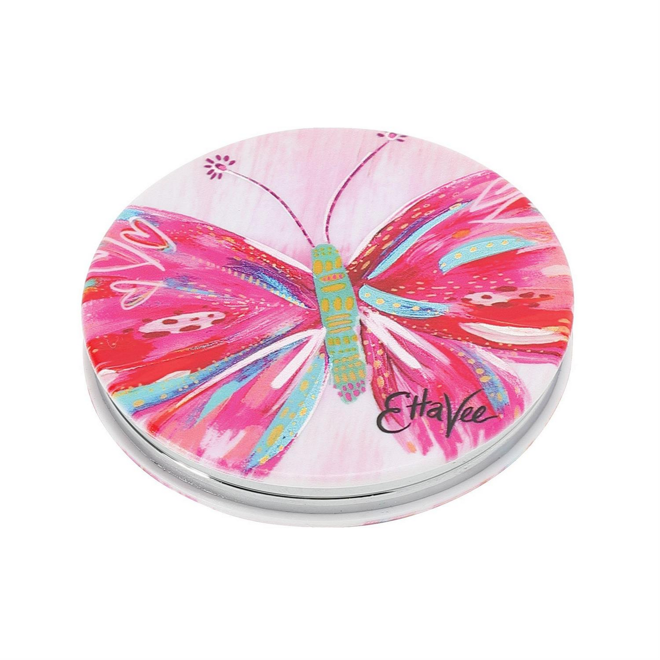 The Magnifying Compact Mirror is a round accessory with a vibrant butterfly design by Jessi Raulet, featuring pink and red shades, accented with blue, green, and white. Background in pink and white with "EttaVee" signed in black. Sizes available: Small, Medium.