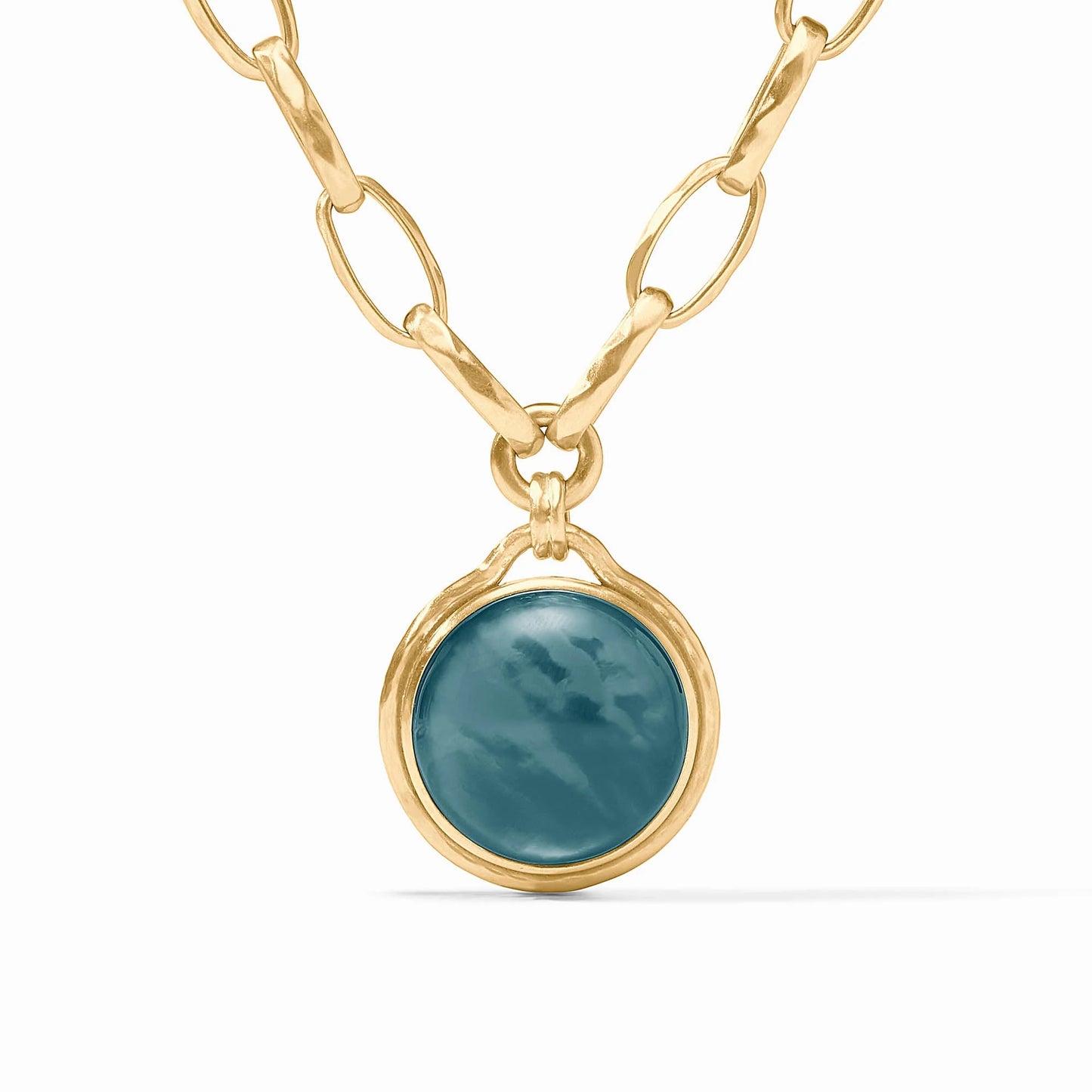 Solara Statement Necklace features 24K gold-plated oval links and iridescent blue pendant. Available in standard length.