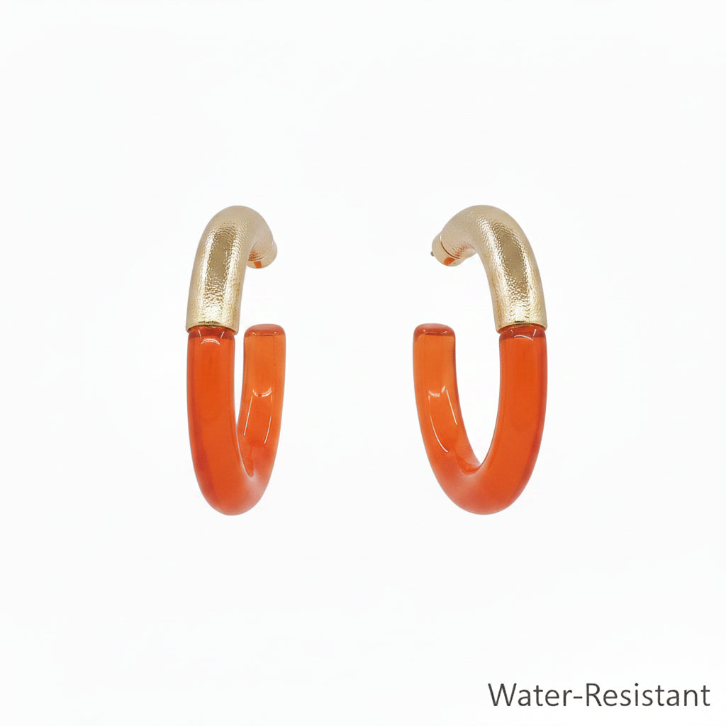 Teo Resin & Gold Hoop Earrings with orange resin lower halves and textured gold upper halves, water-resistant. Sizes available: S, M, L.