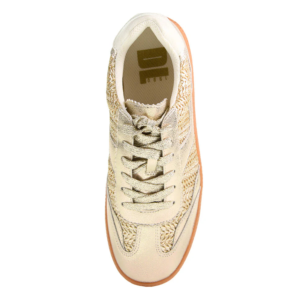 The Tropics Sneaker - Metallic Gold features a textured beige and gold design with sparkly golden elements, laces, woven detailing, and a tan sole. Sizes available: 6-11.