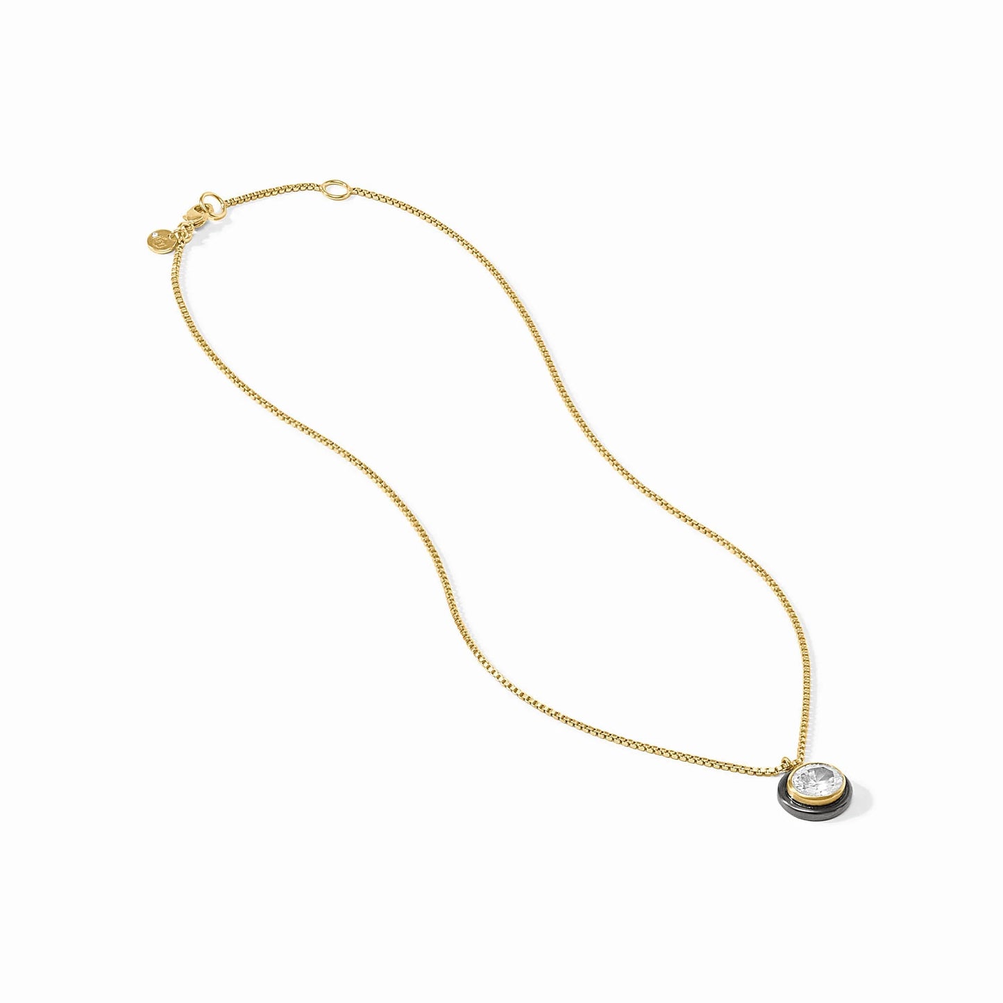 Gold-plated Tribeca Delicate Necklace with round bezel-set cubic zirconia pendant and small gold tag by the clasp. Sizes: 16", 18".