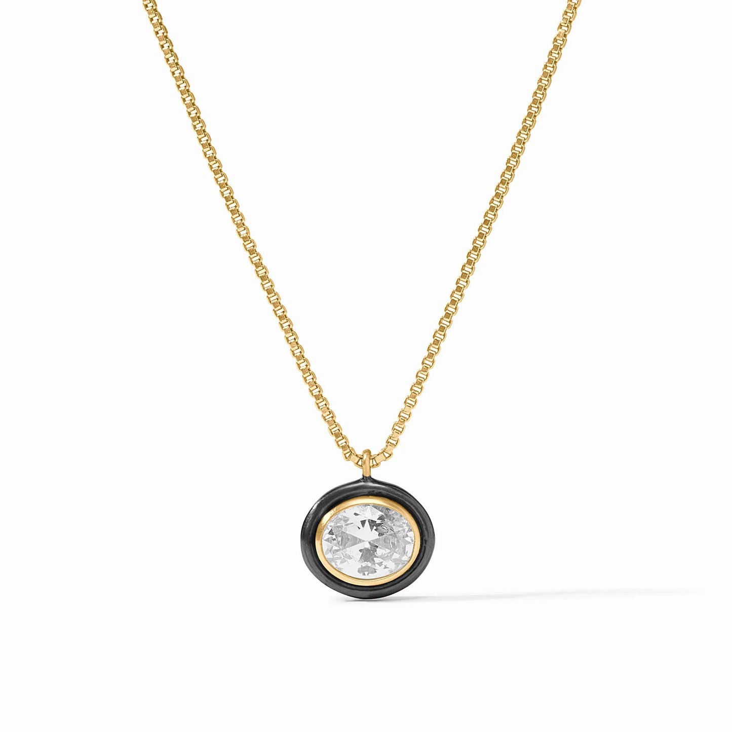 Gold plate chain with round cubic zirconia pendant in black frame. Available sizes: 16", 18".