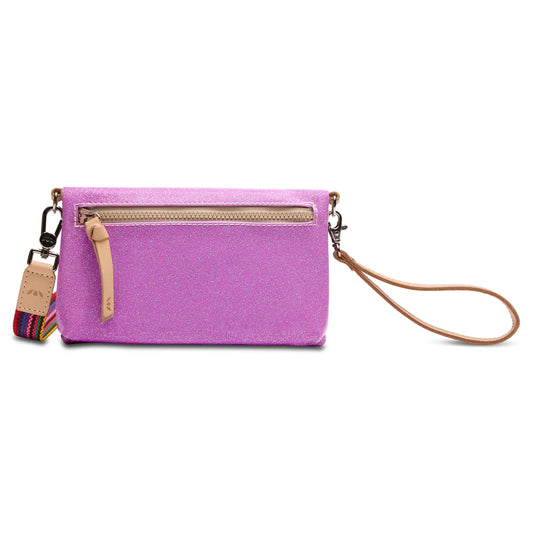 Small rectangular sparkly pink clutch with front zipper pocket, tan leather zipper pull, detachable wristlet strap, multicolored accent strap, and multiple zip compartments. Available size: 8" W x 5" H x 1.5" D.