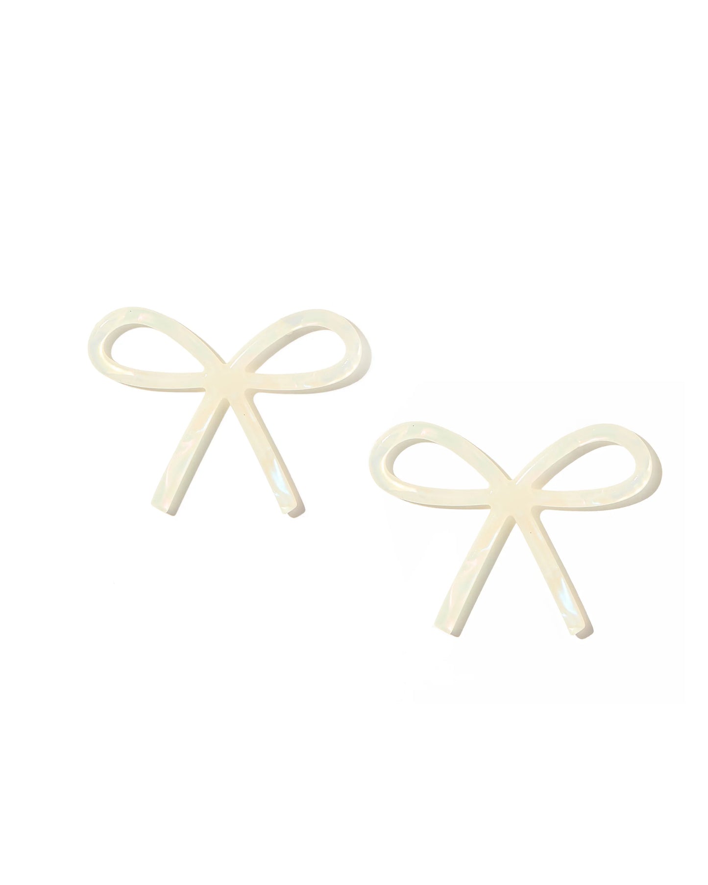 The Lola Bow Earrings are crafted from eco-friendly cream acetate with a smooth, glossy finish in a stylish bow shape. Sizes available: one size.