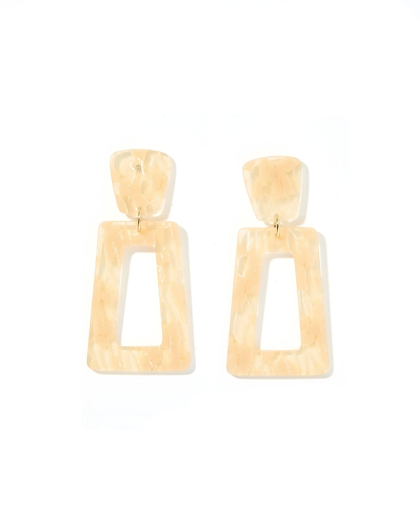 The Kennedy Earrings: Statement earrings with beige, marbled rectangle drops and smaller rectangular tops. Glossy finish with brass-tone connectors. Available in one size.