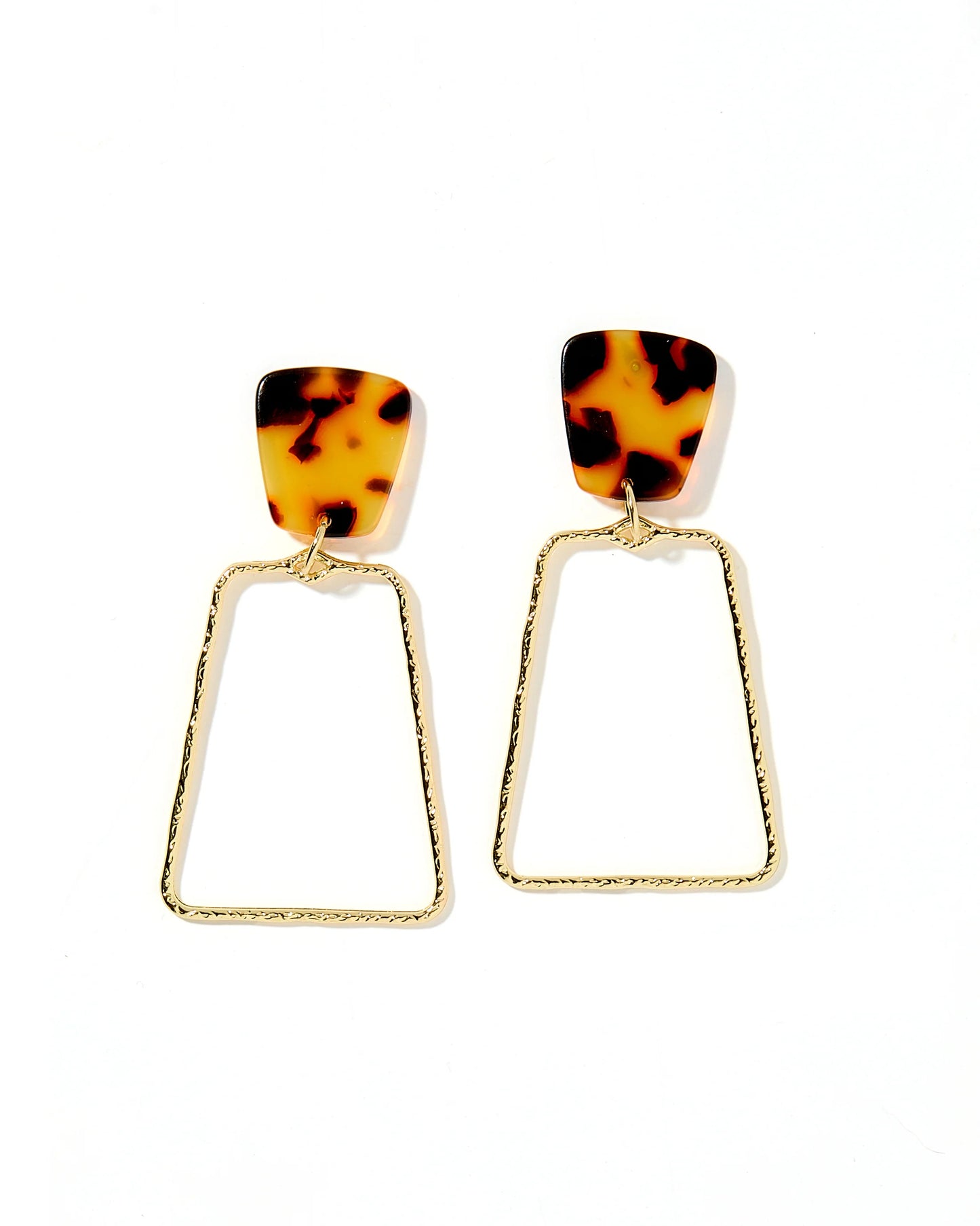 The Kaelyn Earrings feature gold-tone tortoiseshell-patterned rectangular studs connected to open triangular hoops. Made from gold-plated alloy, ideal for sensitive ears. Sizes: One Size.