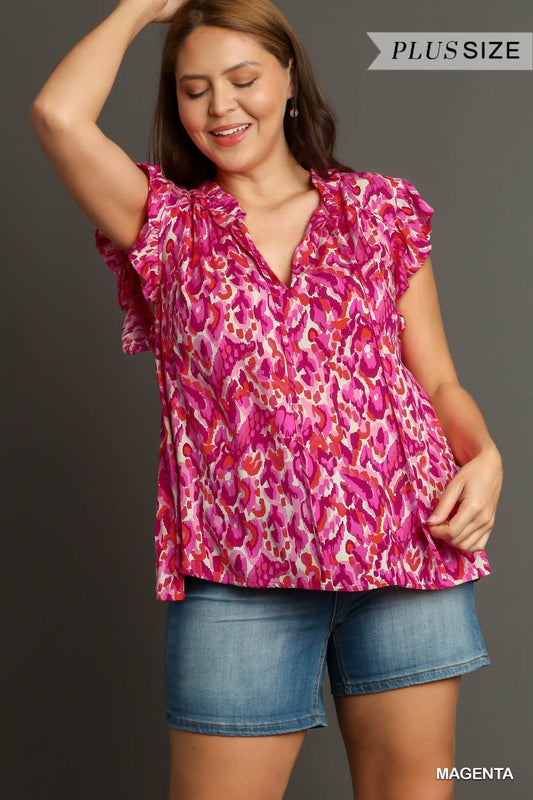 The Mixed Print Boxy Cut Top with Flutter Sleeves is a blended print design featuring relaxed, fluttering sleeves. Comes in plus sizes.