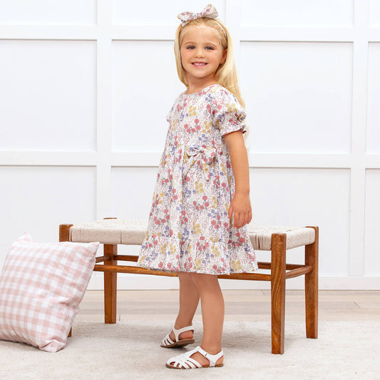 Meadow Garden Cotton Dress with matching hair bow, available in sizes 2T-7.