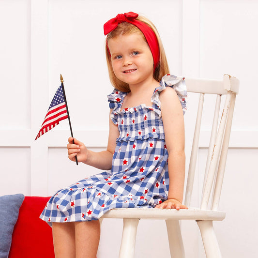 Americana Bamboo Smocked Dress: blue gingham, red stars, girls’ summer style. Available in sizes 2T–10.