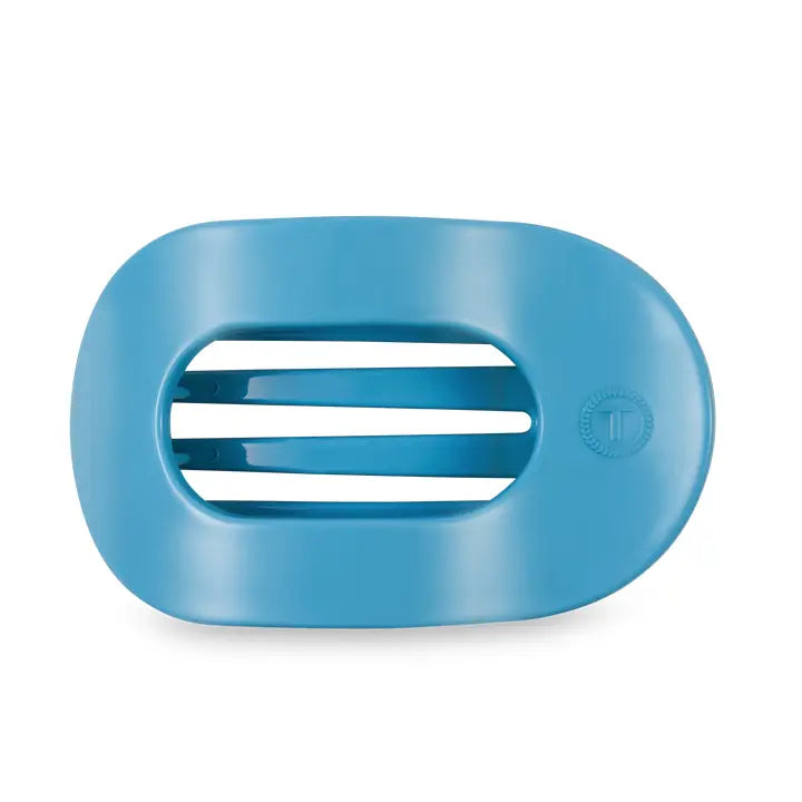 Blue oval soap dish with two horizontal slats and small embossed logo. Available in standard and large sizes.