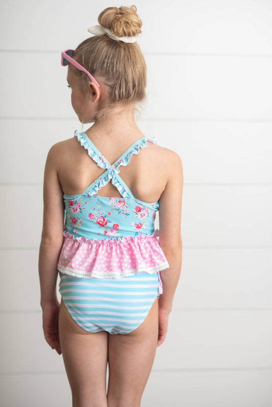Kids Pink & Blue Ruffle Cross Back 2 Piece Swimsuit with floral details, pink accents. Available in sizes 2T-10.