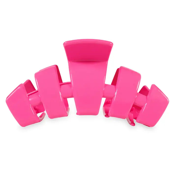 Vibrant pink TELETIES Classic Claw Hair Clip with wide prongs and spring mechanism. Available in small, medium, and large sizes.