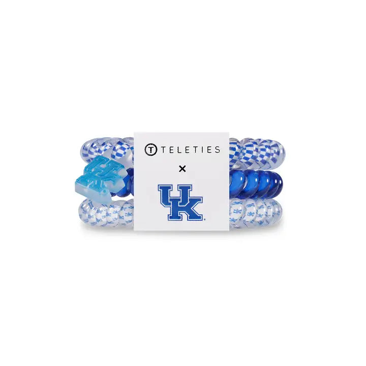 Three blue and white TELETIES Hair Ties with TELETIES and “UK” logos. Available in small, medium, large sizes.