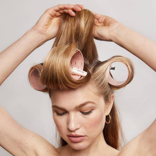 Recycled Plastic XL Ceramic Thermal Rollers 4pc Set in Terracotta, available in XL size, shown lifting hair for volume.