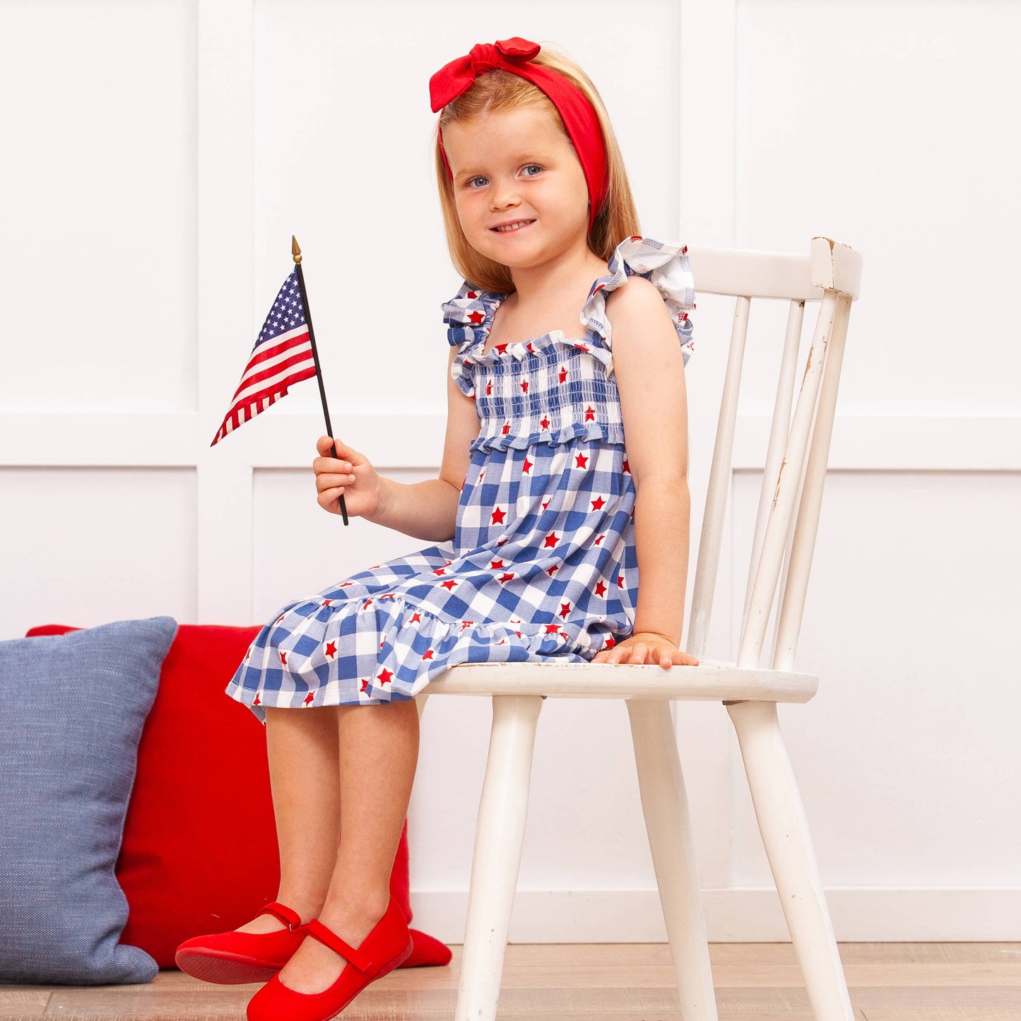 Americana Bamboo Smocked Dress shown; features smocked bodice, patriotic colors. Available in sizes 2T-8Y.