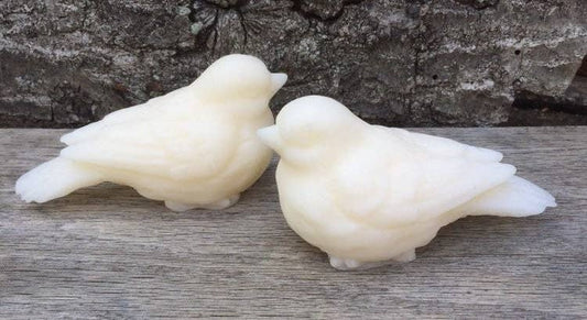 Two white, dove-shaped Sweet Birdy Guest Soaps in Gardenia scent; gentle moisturization; available in standard guest size.