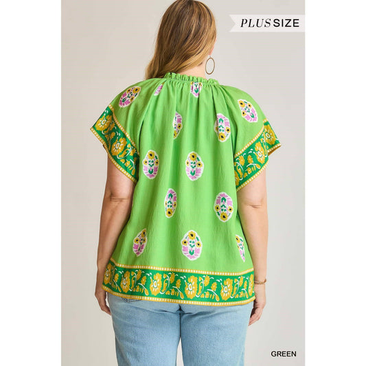 Boho Bloom Border Top: bright green plus-size blouse with patterns, flutter sleeves, yellow floral border. Sizes: plus only.