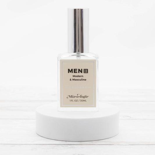Men’s II (Modern & Masculine) Cologne Spray in a clear glass 30 mL bottle with shiny silver cap. Available in 30 mL size.
