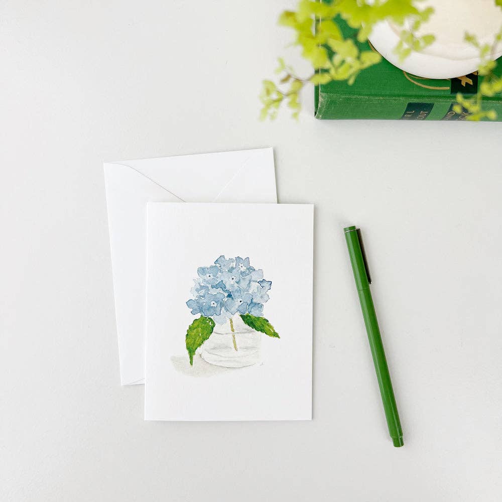 Set of 8 watercolor notecards with blue hydrangea, green leaves, white envelopes. Sizes available: Standard.