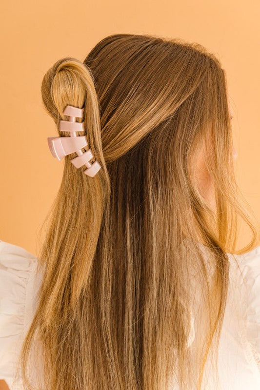 The TELETIES Classic Hair Clip is a stylish accessory for securing hair. Available in one size.