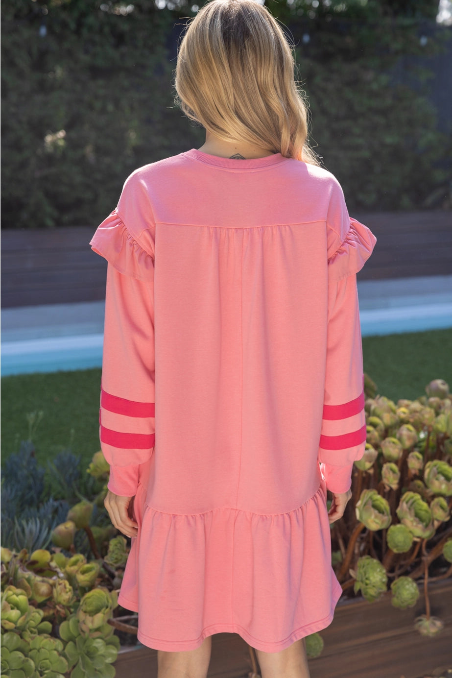 Pink Terry Striped Dress with long puff sleeves, ruffle details, and two horizontal sleeve stripes. Available in XS–L.