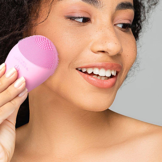 Lemon Lavender It's a Vibe Sonic Cleanser Brush with antibacterial silicone bristles; available in standard and mini sizes.