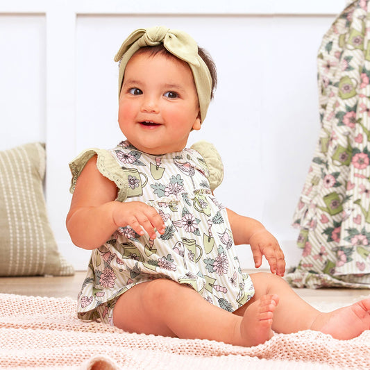 Garden Bloom Skirted Bodysuit, floral print, available in sizes 0-3M to 18-24M.