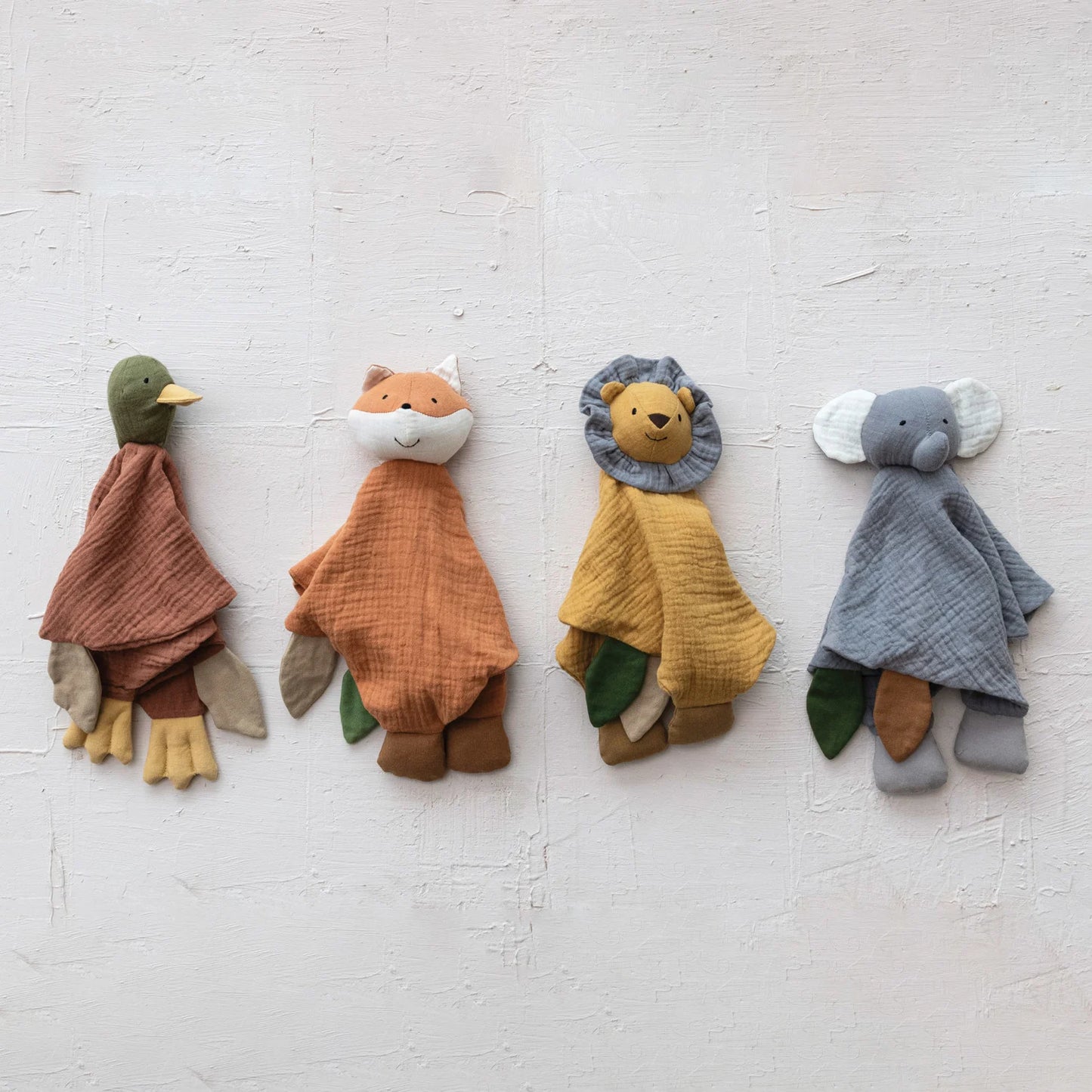 Plush animal snuggle toys made of cotton double cloth, featuring a duck, fox, lion, and elephant. Available sizes: One size each.