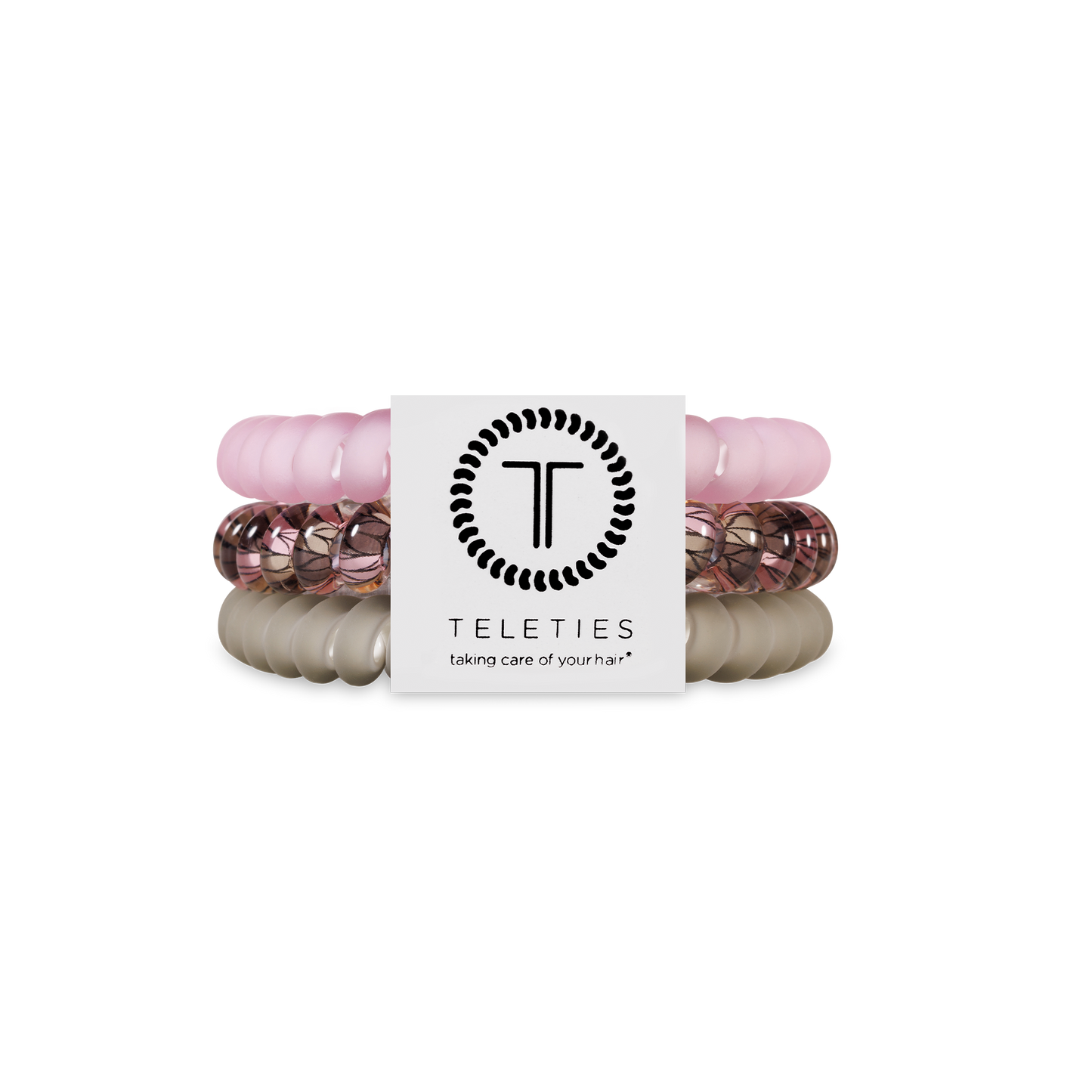 Three TELETIES Hair Ties in light pink, rose gold, and beige. Available in small and large sizes.