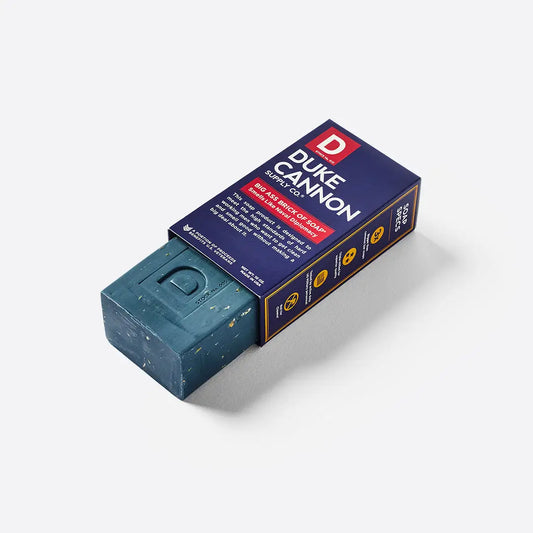 Large rectangular blue soap bar. Scent: Naval Diplomacy. Packaged in navy box labeled "Big Ass Brick of Soap - Naval Diplomacy - Plain Box" with red and white text. Size: 10 oz (283 g).