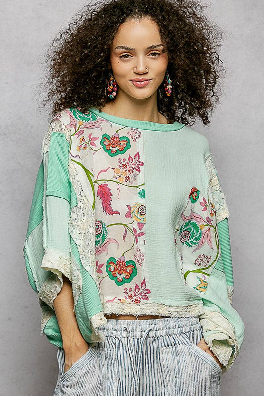Round Neck Double Gauze Floral Woven Top in pastel green and cream patchwork with lace trim. Available in sizes XS-XL.