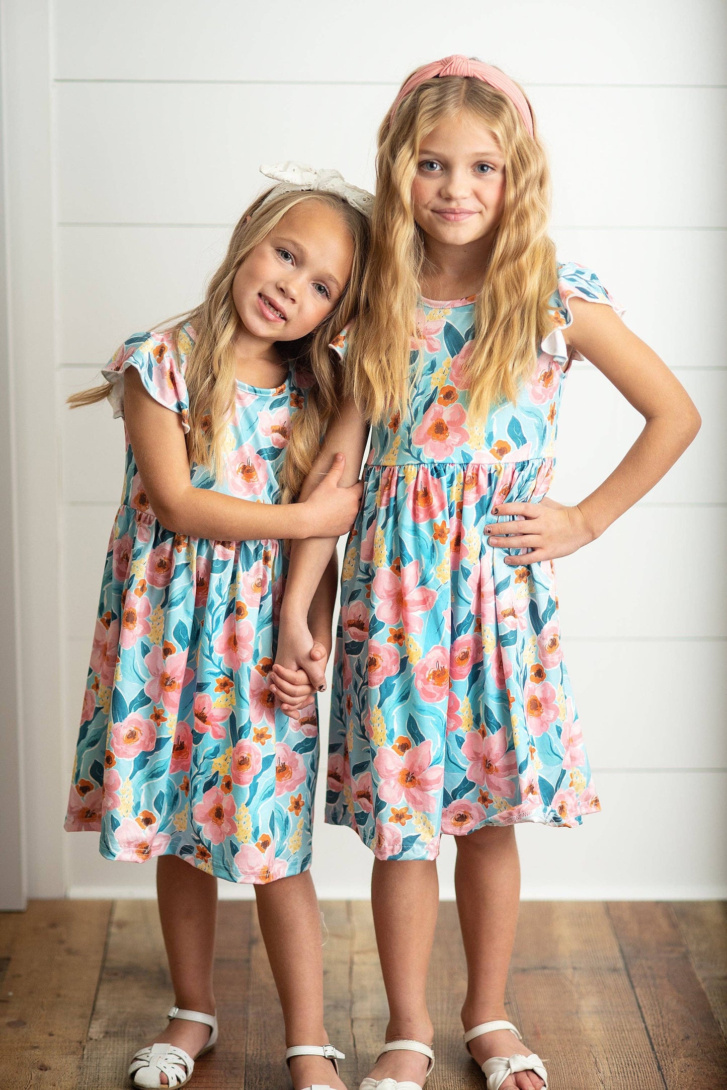 Girls Claire Pink Floral Print Twirl Dress shown; available in sizes 2T-10.