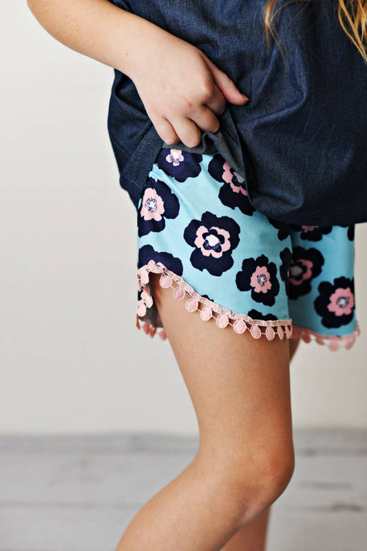 Kids Dark Jean Flower Ruffle Short Set: dark blue top, floral navy and pink shorts with pink pom-pom trim. Sizes 2T-7.