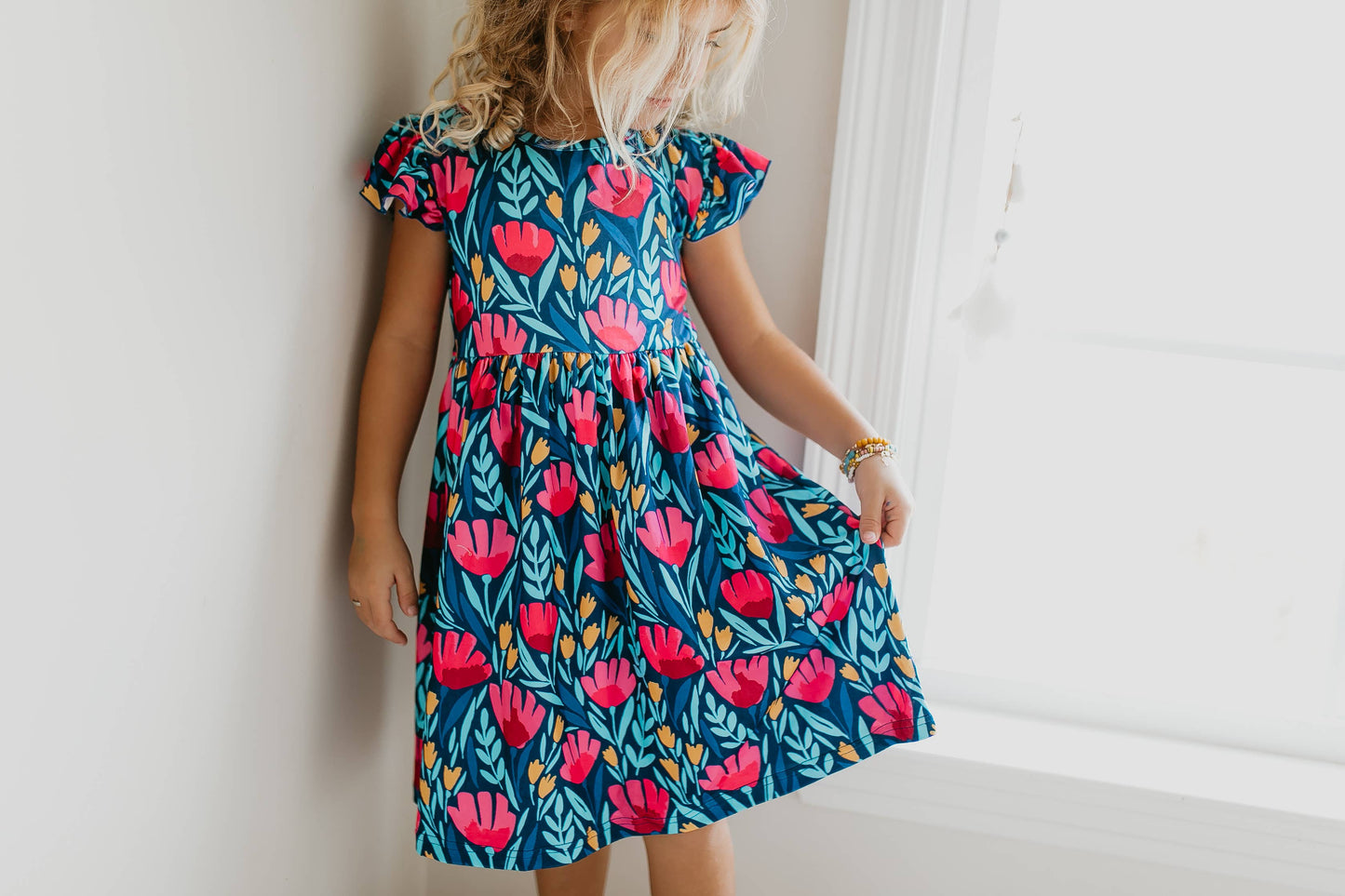 Kids Blue Floral Flutter Sleeve Dress with red and pink flowers, available in sizes 2T-8.