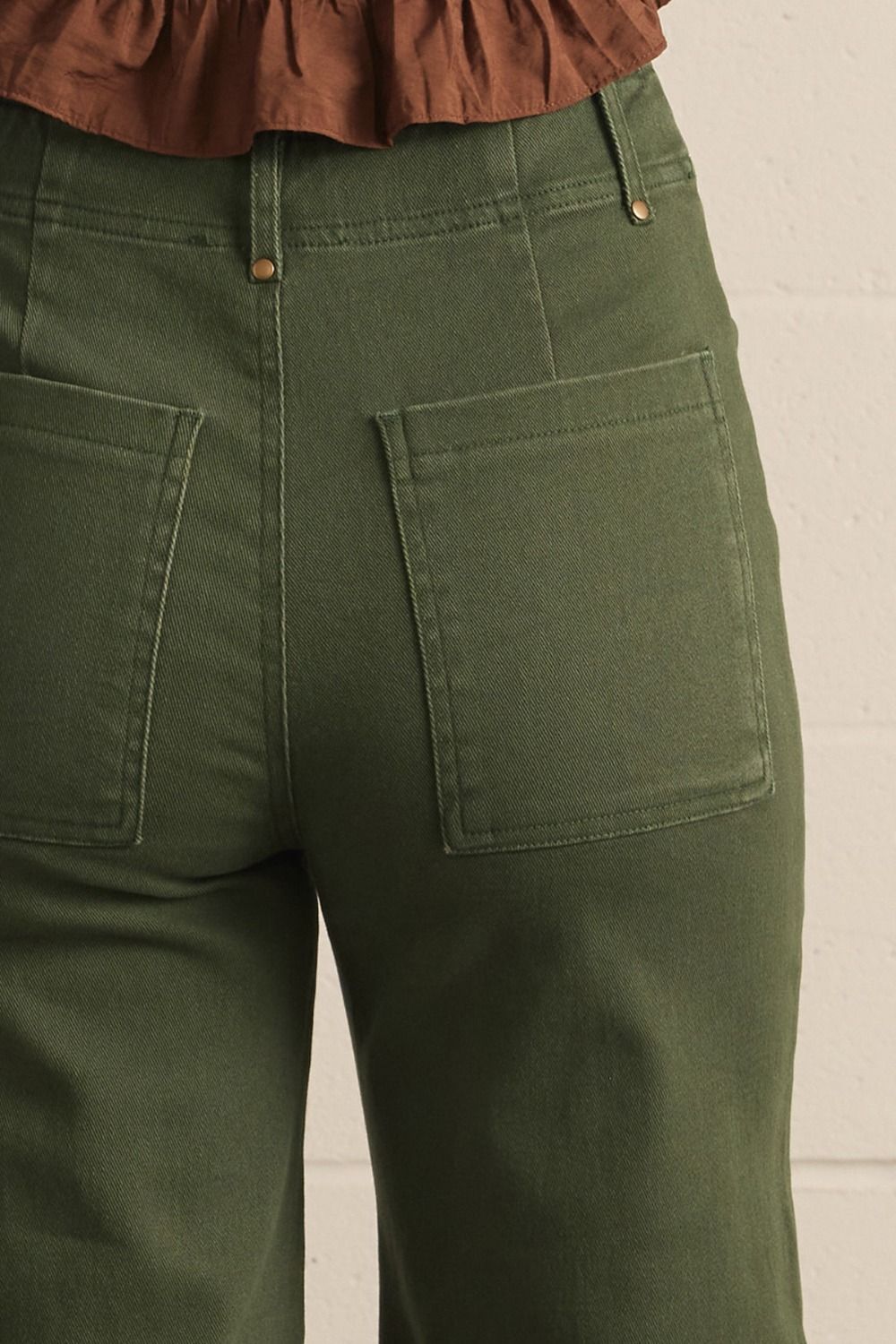 Evergreen High Rise Wide Leg Pants in hunter green with large back pockets; available in sizes XS-XL.