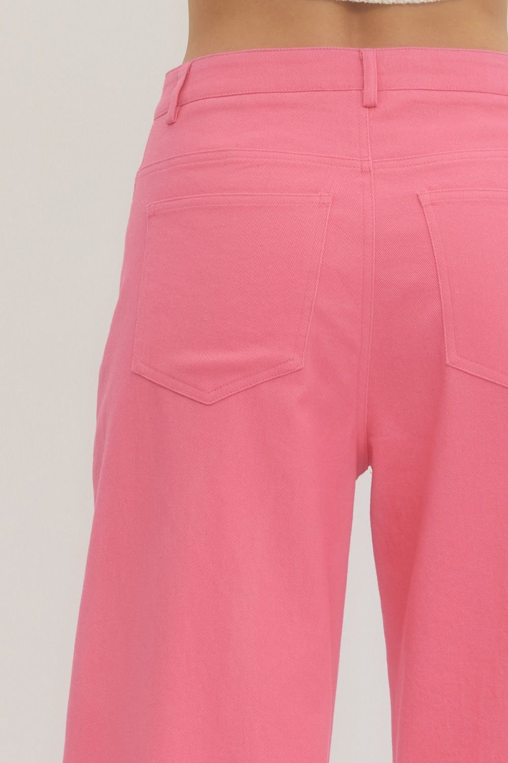Back view of Poppy Pink MR Ankle Length Pants with waistband, back pockets, lightweight woven fabric. Available in sizes XS-XL.