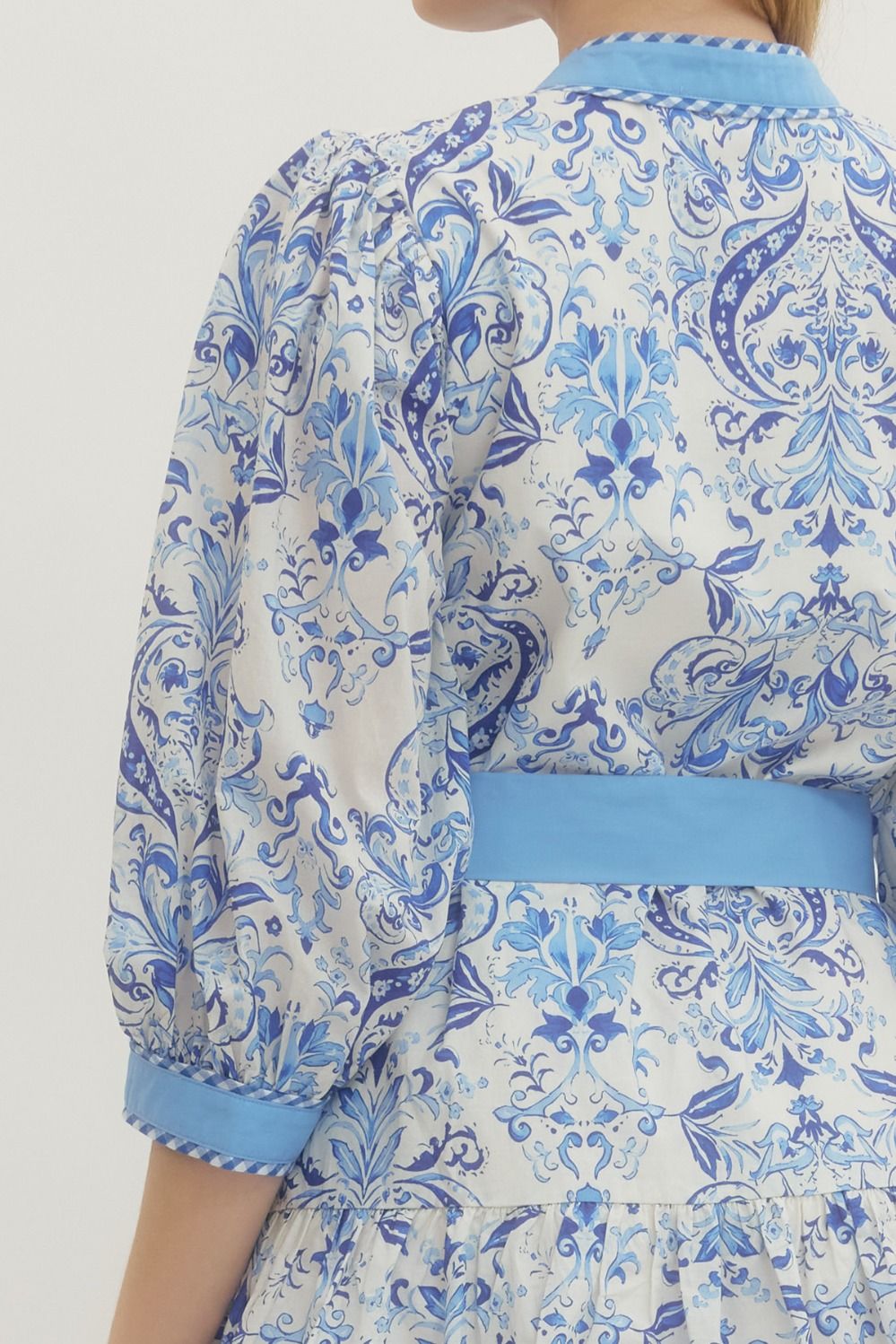 Royal Printed Long Sleeve Belted Dress with blue and white floral pattern, light blue belt. Available in sizes S-XL.