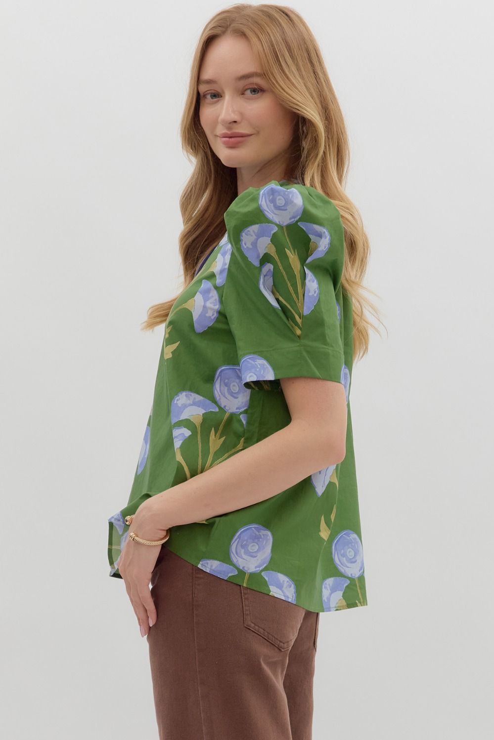 Mabel Blooming Day Top: green floral blouse with blue prints. Available in sizes XS–XL.