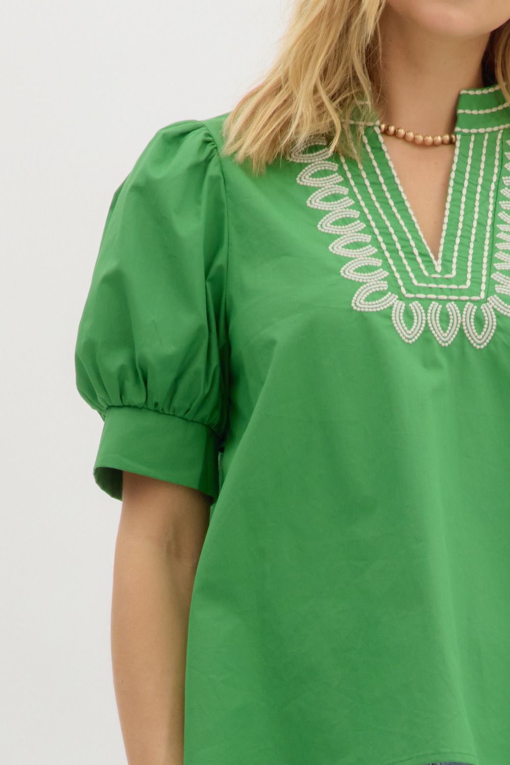 Garden Path Embroidered Top: lightweight green blouse, puffed sleeves, white embroidery at neckline. Sizes XS-XL available.