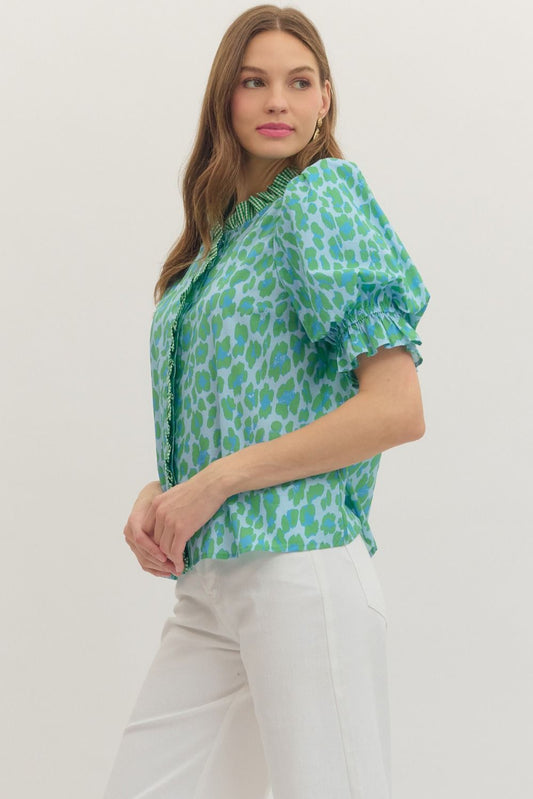 Green Leopard Puff Sleeve Ruffle Top with short puff sleeves. Available in sizes XS–XL.