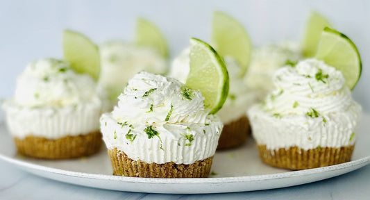 Keylime Pie Cheesecake Dip with crumbly crust, whipped cream, lime zest, and fresh lime. Available in 8oz and 16oz sizes.