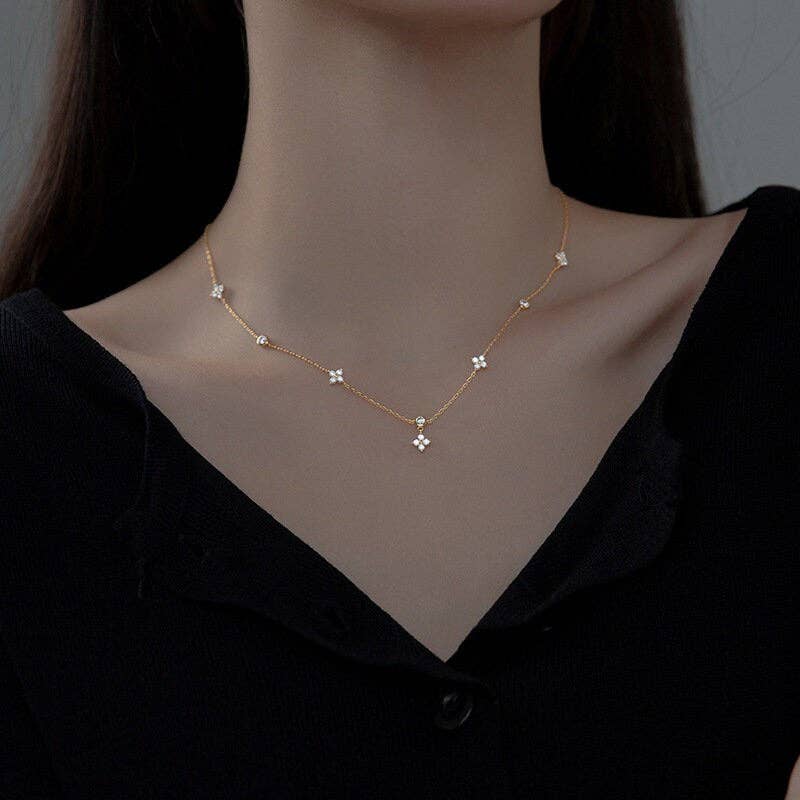 Four Petal Flower Friendship Necklace in 925 Sterling Silver with cubic zirconia petals. Available in 16", 18", and 20" lengths.