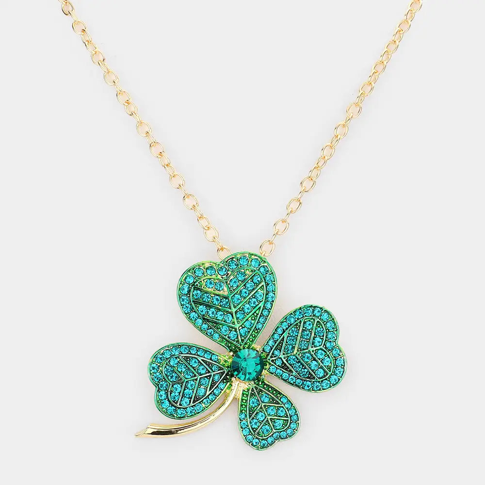 St. Patrick's Day Clover Pendant Necklace: Three-leaf clover shape with green and turquoise gemstones, larger central stone. Available size: one-size-fits-all chain.
