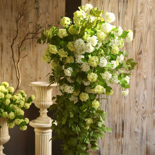 Premium Faux Snowball Hydrangea Spray: Lush, cascading 40" long with 5 blooms. Available in shades of white and light green.