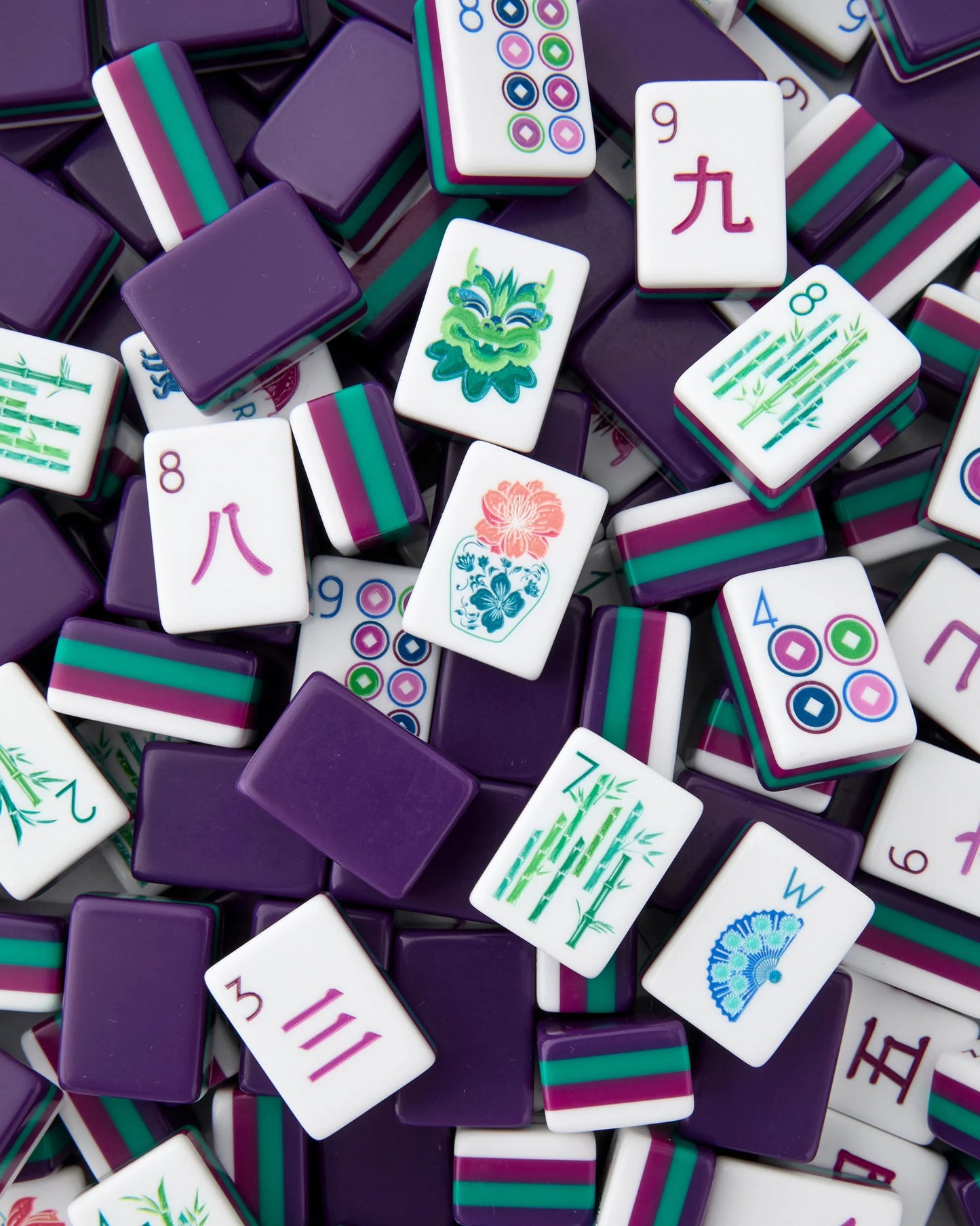 Gemma Mahjong Tiles in purple with teal, white, magenta edges; numbers, characters, flowers, bamboo. Available in multiple sizes.