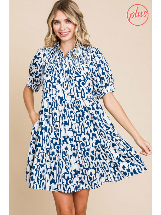 Navy Print Dress with Pockets exhibits a charming print throughout, complemented by convenient pockets. Available in sizes S to XL.