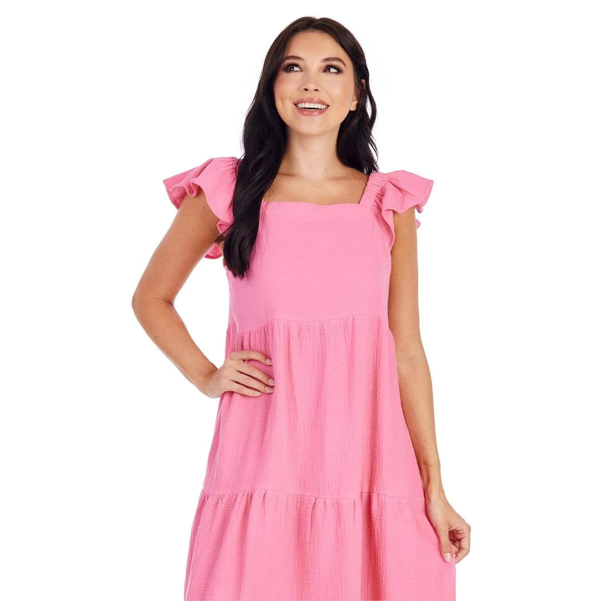 The Everlane Day Dress is a pink garment, ideal for casual wear. The dress is available in various sizes to suit the wearer's preference.