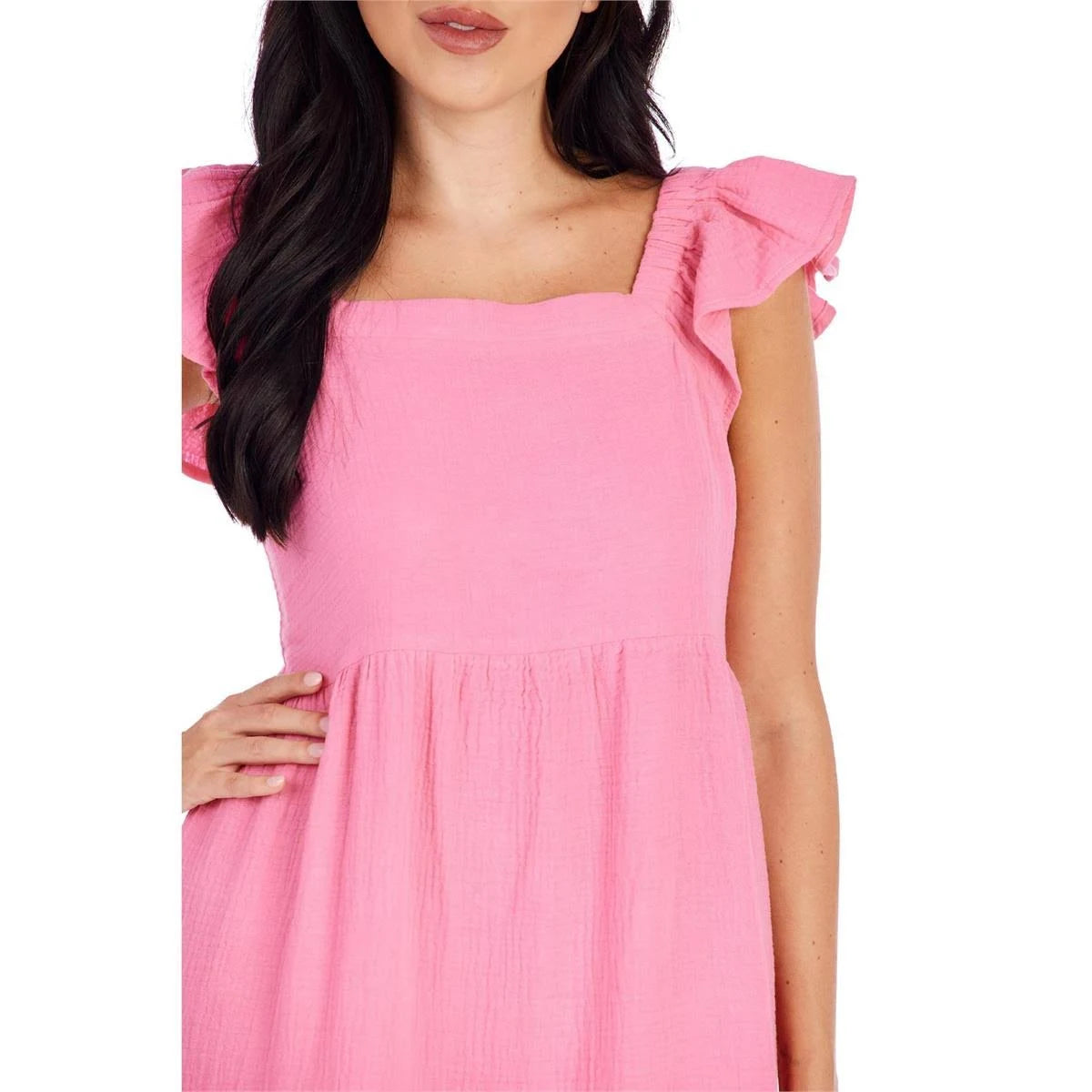 The Poppy Maxi Dress is a charming, pink dress offering stylish details such as ruffled sleeves and a square neckline. It features a flattering gathered waistline, enhancing its flowing silhouette. The dress is available in various sizes.