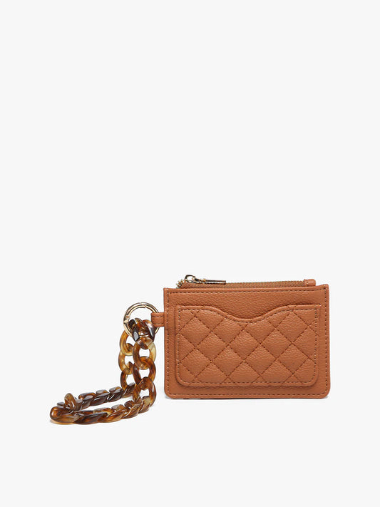 Tan quilted vegan leather wallet with zip pocket, exterior slot, tortoiseshell keyring, acrylic strap. Sizes: S/M/L.