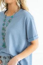 Two-Tone Waffle Knit Top in light blue. Features textured fabric and relaxed fit. Sizes available: S, M, L, XL.